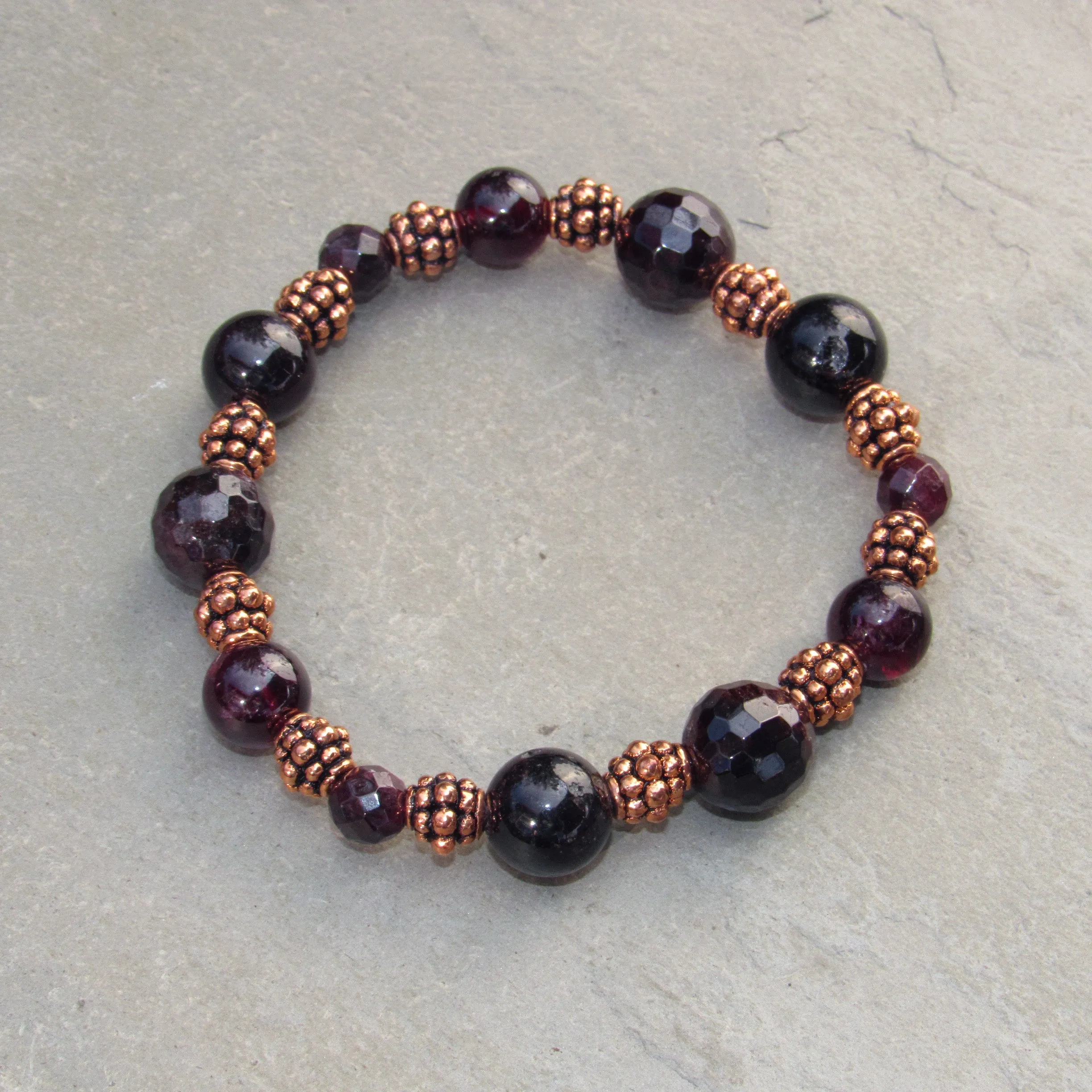 Garnet gemstone and copper stretch bracelet