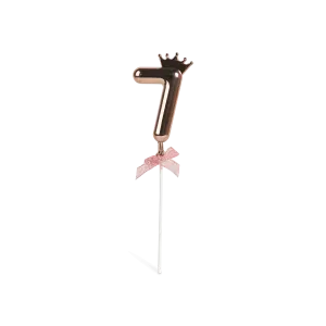 Number 7 on a stick with a rose gold crown