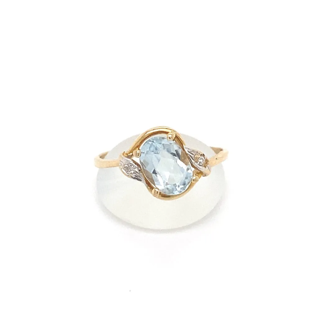 Oval Aquamarine with Diamond Accent in 14kt Yellow Gold.